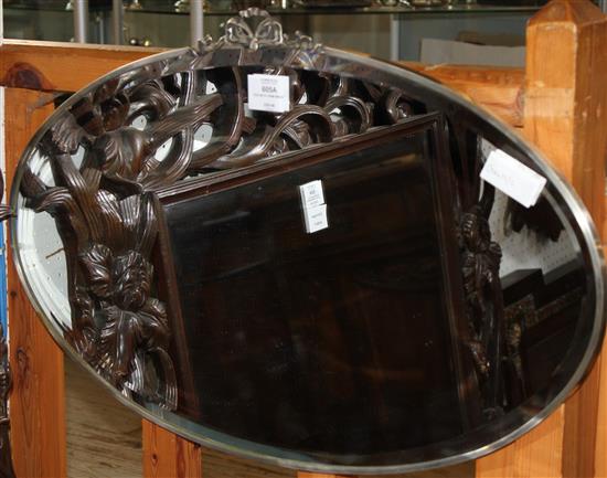 Oval metal frame mirror